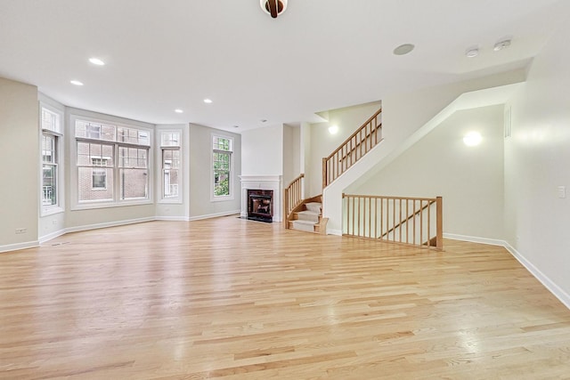 unfurnished living room featuring light hardwood / wood-style flooring