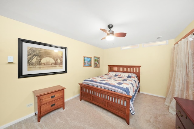 bedroom featuring ceiling fan and light carpet