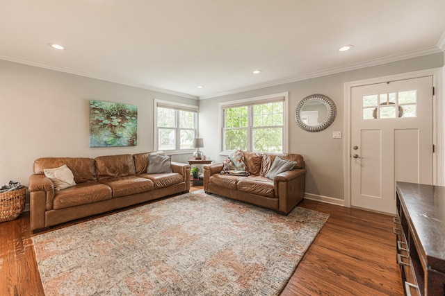 living room with dark hardwood / wood-style flooring and ornamental molding