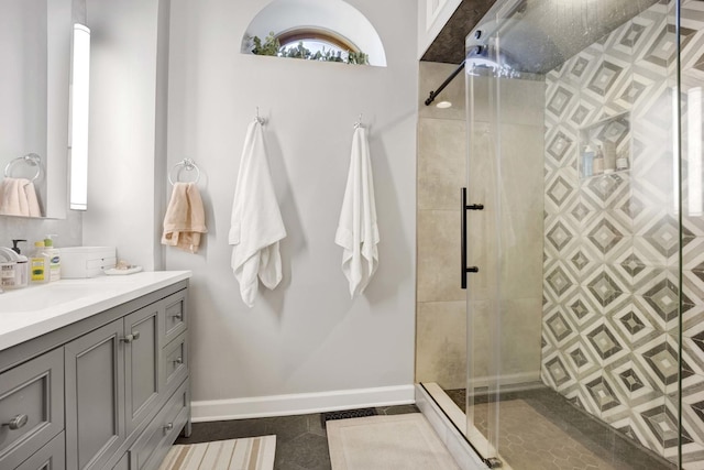 bathroom featuring vanity, tile patterned floors, and an enclosed shower