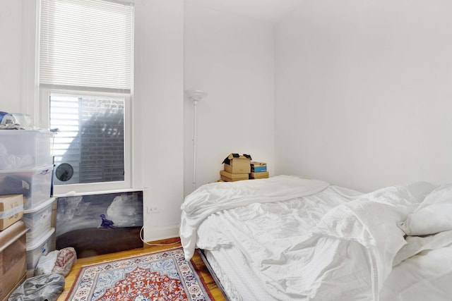 bedroom with wood-type flooring