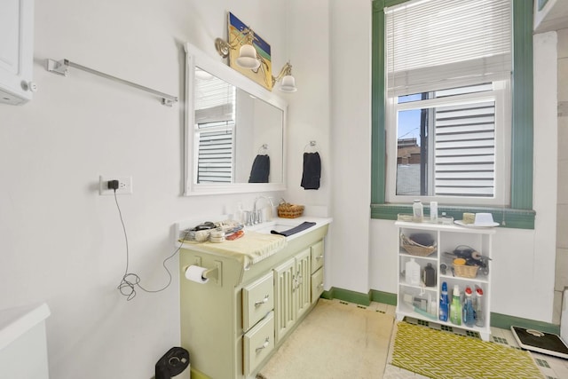 bathroom featuring tile patterned flooring and vanity