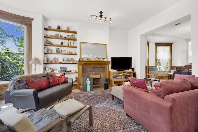 living room with a premium fireplace