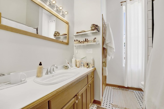 bathroom with vanity and toilet