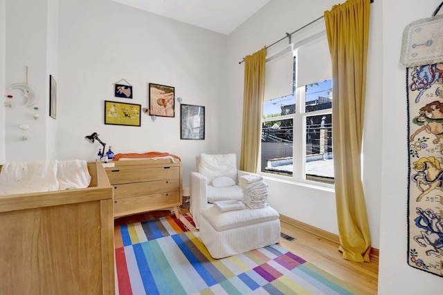 living area featuring hardwood / wood-style floors