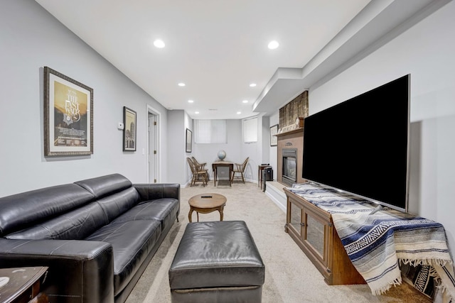 carpeted living room with a fireplace