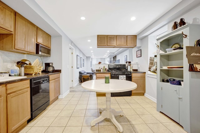 kitchen with light tile patterned flooring and black appliances