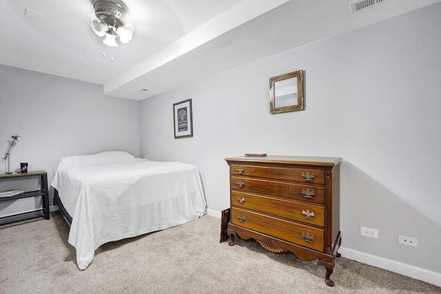 bedroom with light colored carpet