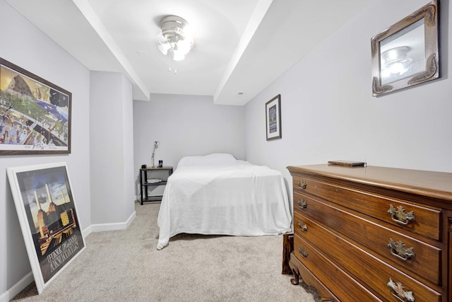 bedroom featuring light colored carpet