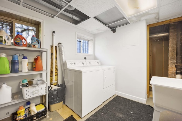 laundry room featuring separate washer and dryer and sink