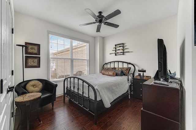 bedroom featuring dark hardwood / wood-style floors and ceiling fan