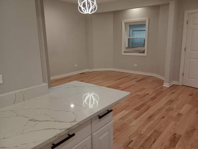 spare room featuring light wood-type flooring