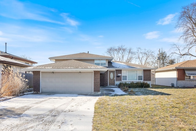 view of front of property featuring a garage and a front lawn