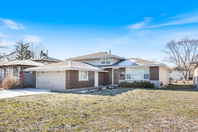 view of front of property featuring a garage and a front yard