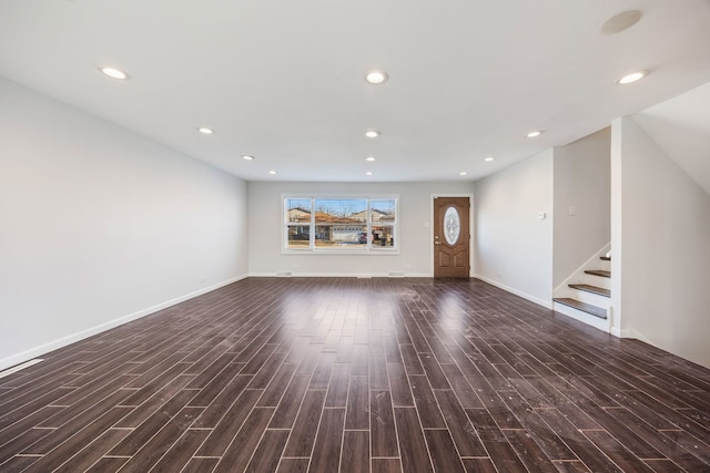 unfurnished living room with dark hardwood / wood-style flooring