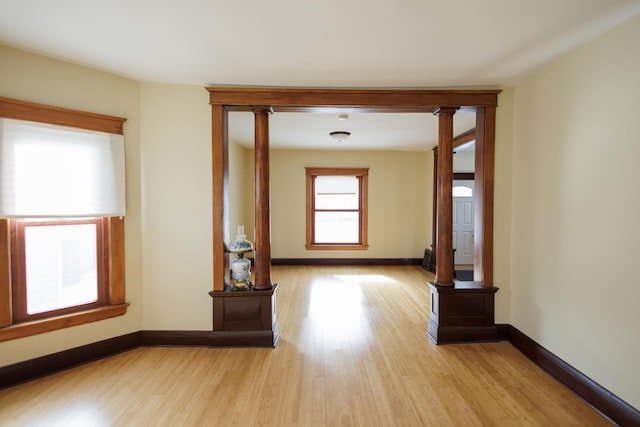 hallway with light hardwood / wood-style floors