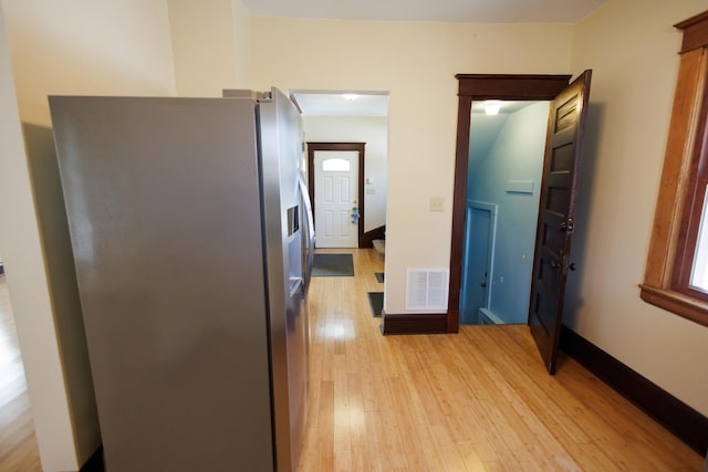 corridor featuring light hardwood / wood-style floors