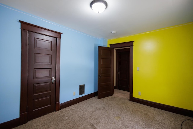 unfurnished bedroom featuring carpet flooring