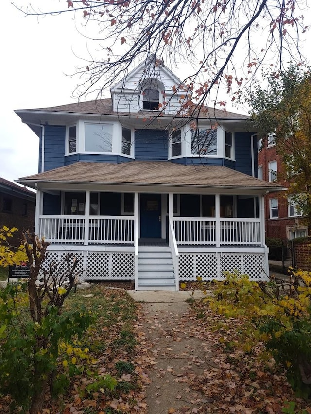 country-style home featuring a porch