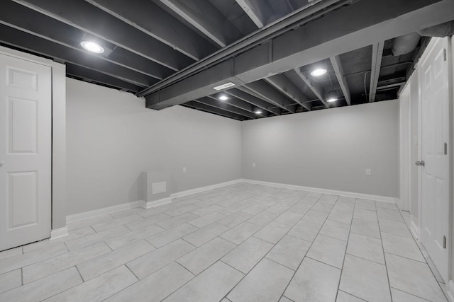 basement with light tile patterned floors