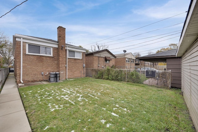 view of yard featuring central AC unit