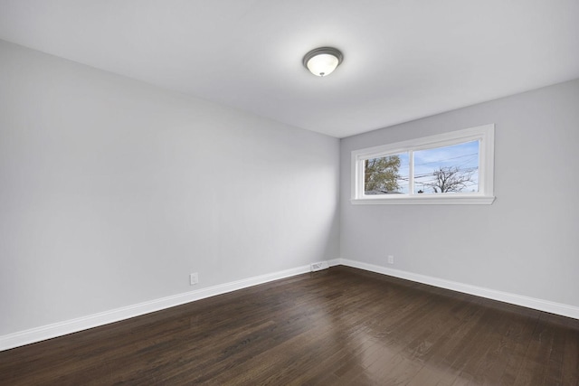 spare room featuring hardwood / wood-style floors