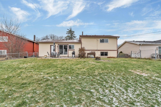 back of property featuring a lawn and a patio area