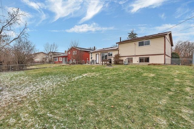 back of house with a yard