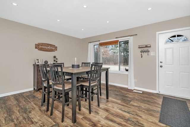 dining room with dark hardwood / wood-style floors