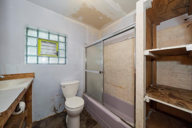 full bathroom with vanity, toilet, and bath / shower combo with glass door