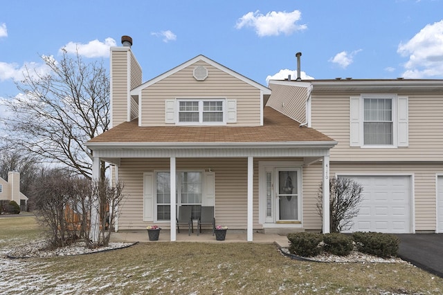 view of front facade featuring a garage and a front lawn