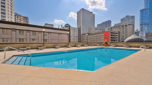 view of swimming pool with a patio area