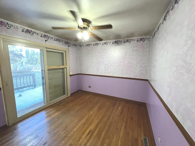 unfurnished room with hardwood / wood-style floors and ceiling fan