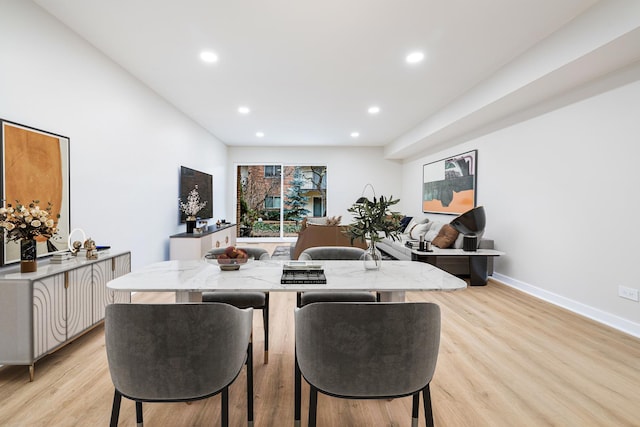 dining area with light wood-type flooring