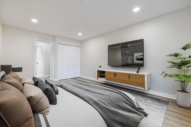 bedroom featuring a closet and light hardwood / wood-style flooring