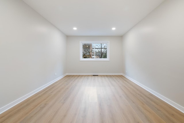 spare room with light wood-type flooring