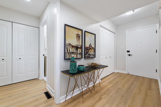 foyer with light hardwood / wood-style floors