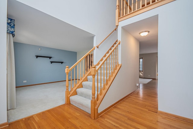 stairs with wood-type flooring