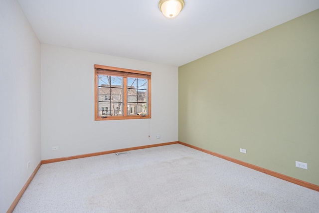 empty room with carpet flooring