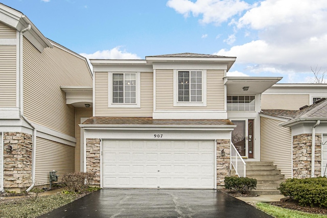 townhome / multi-family property featuring a garage