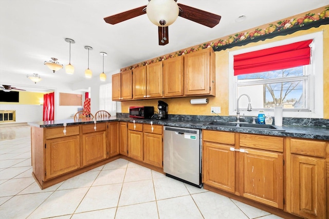 kitchen with light tile patterned floors, ceiling fan, decorative light fixtures, stainless steel dishwasher, and sink