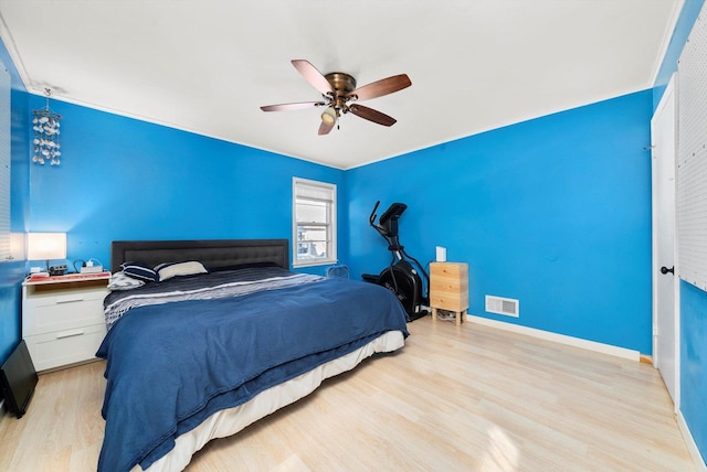 bedroom featuring ceiling fan and light hardwood / wood-style floors