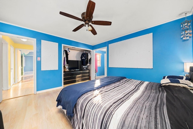 bedroom with ceiling fan, a closet, and light wood-type flooring