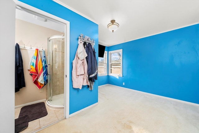 bathroom with tile patterned flooring and a shower with shower door