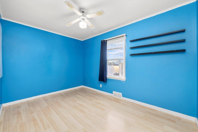 unfurnished room featuring ceiling fan, light hardwood / wood-style flooring, and ornamental molding