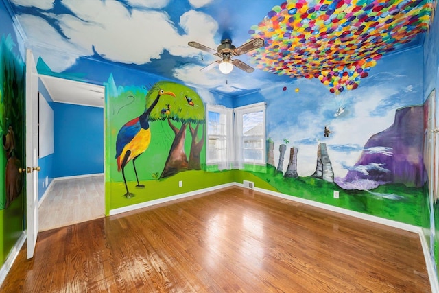 unfurnished room with ceiling fan and wood-type flooring