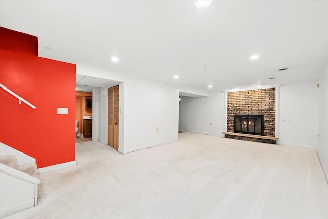 carpeted living room with a fireplace