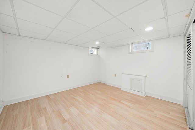 basement with light hardwood / wood-style floors