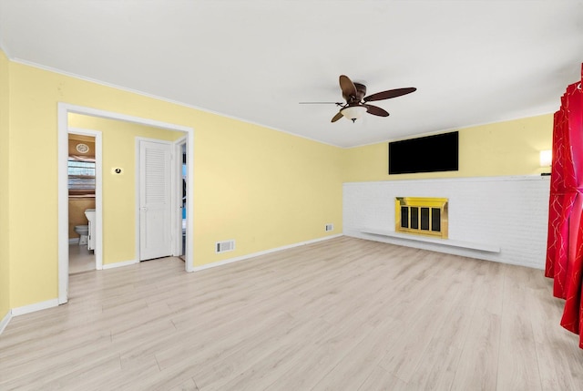 unfurnished living room with light wood-type flooring and ceiling fan