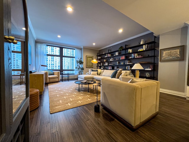 living room with dark hardwood / wood-style floors and crown molding